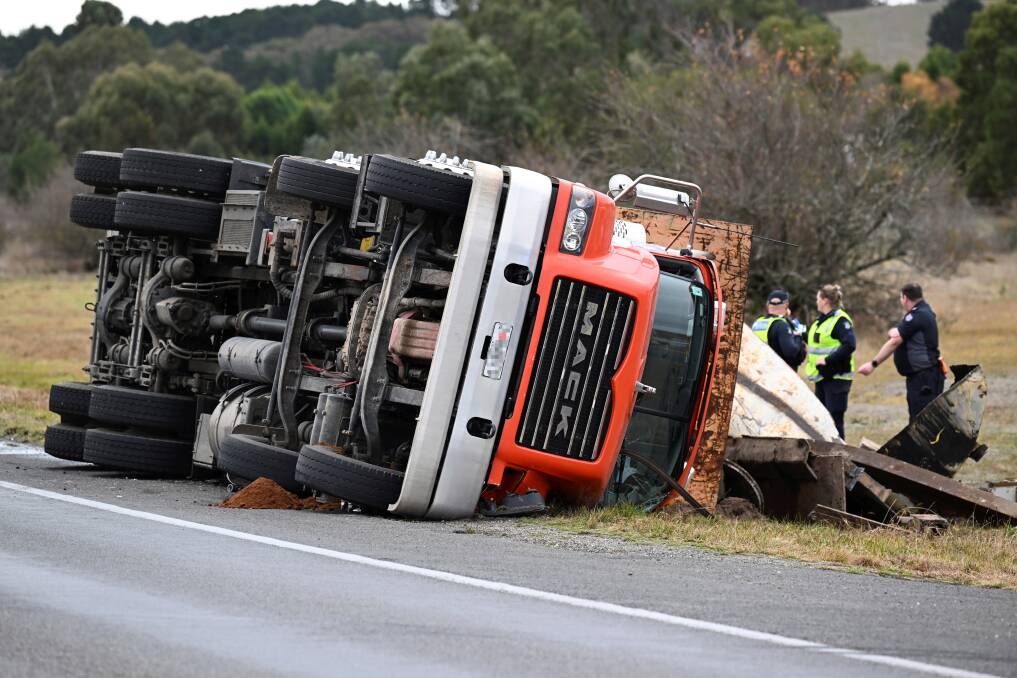 Damaged shipping container from a truck accident on Australian road – highlighting the importance of cargo freight insurance by B2B Freight Solutions